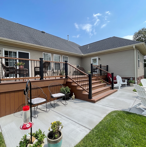backyard deck with railing stairs