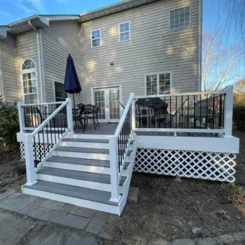 Backyard deck installation with railings