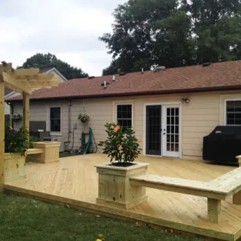 Backyard wood deck pergola installation