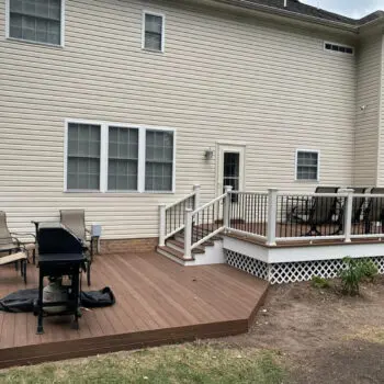 Backyard deck installation with railing