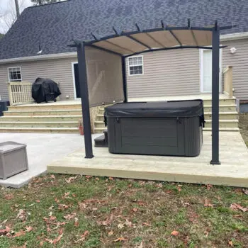 Backyard deck installation with pergola