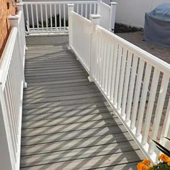 white deck railing installation walkway