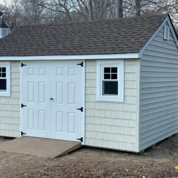Backyard shed near privacy fence