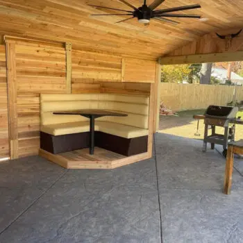 Covered patio with wooden fence