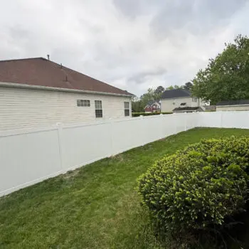 White vinyl privacy fence backyard