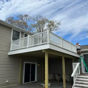 Person installing deck railing fence