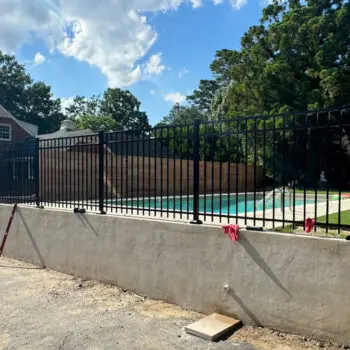 Black metal pool safety fence