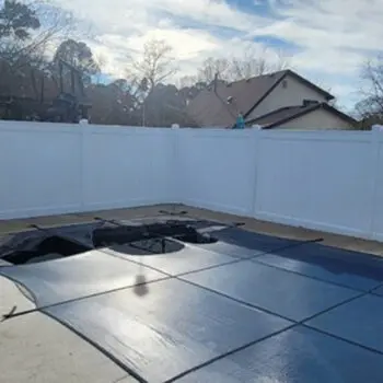 White vinyl fence around patio