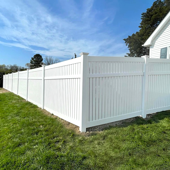 White vinyl privacy fence installation