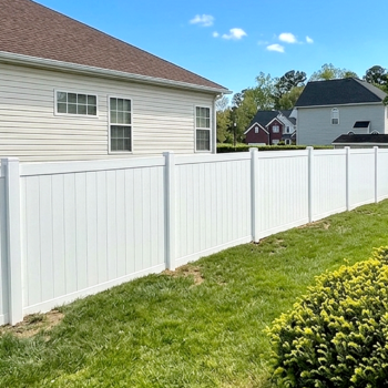 White vinyl privacy fence installation